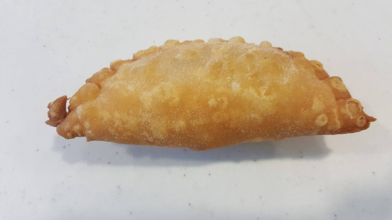 A golden fried pastechi, the beloved Curaçao breakfast pastry