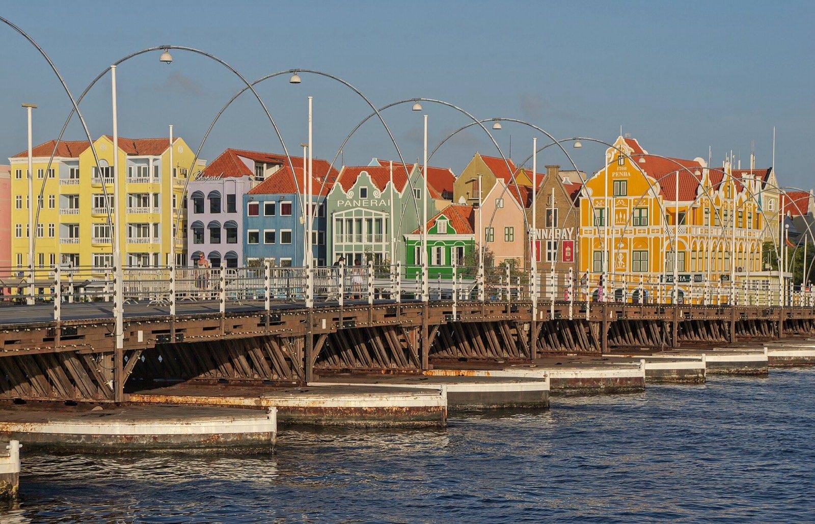 The Queen Emma pontoon bridge resting on its floats across St. Anna Bay in Willemstad